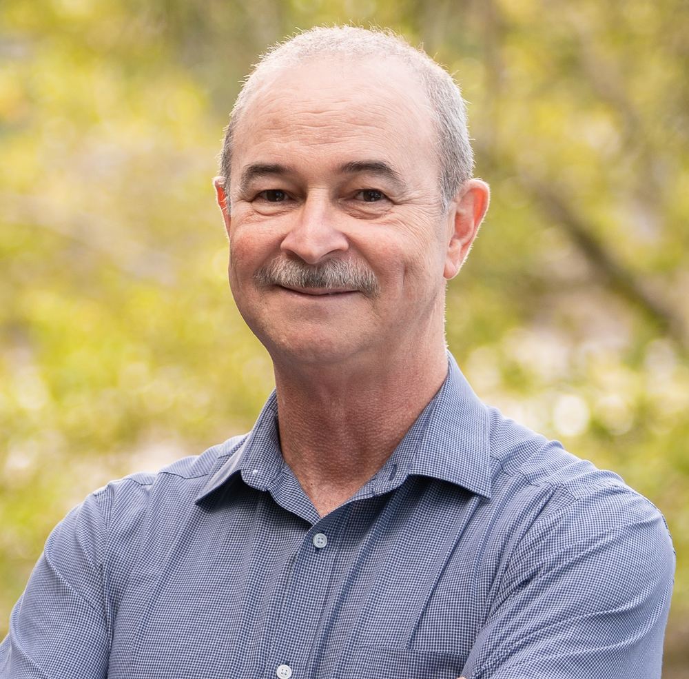 Marcos, hypnotherapist and counsellor, smiling outdoors